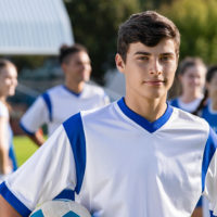 A young man in a soccer uniform.