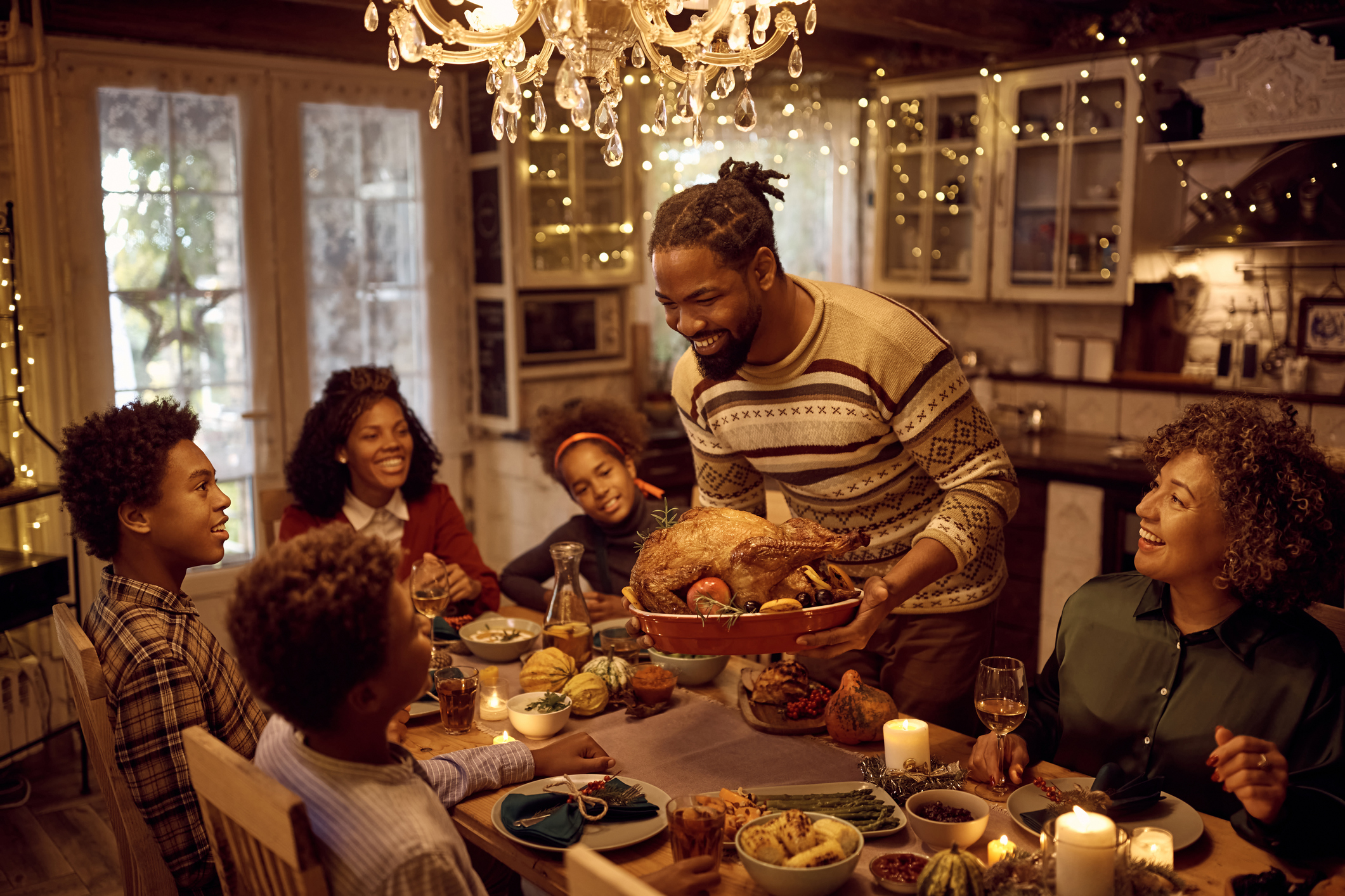 A family sharing a meal together for the holidays.